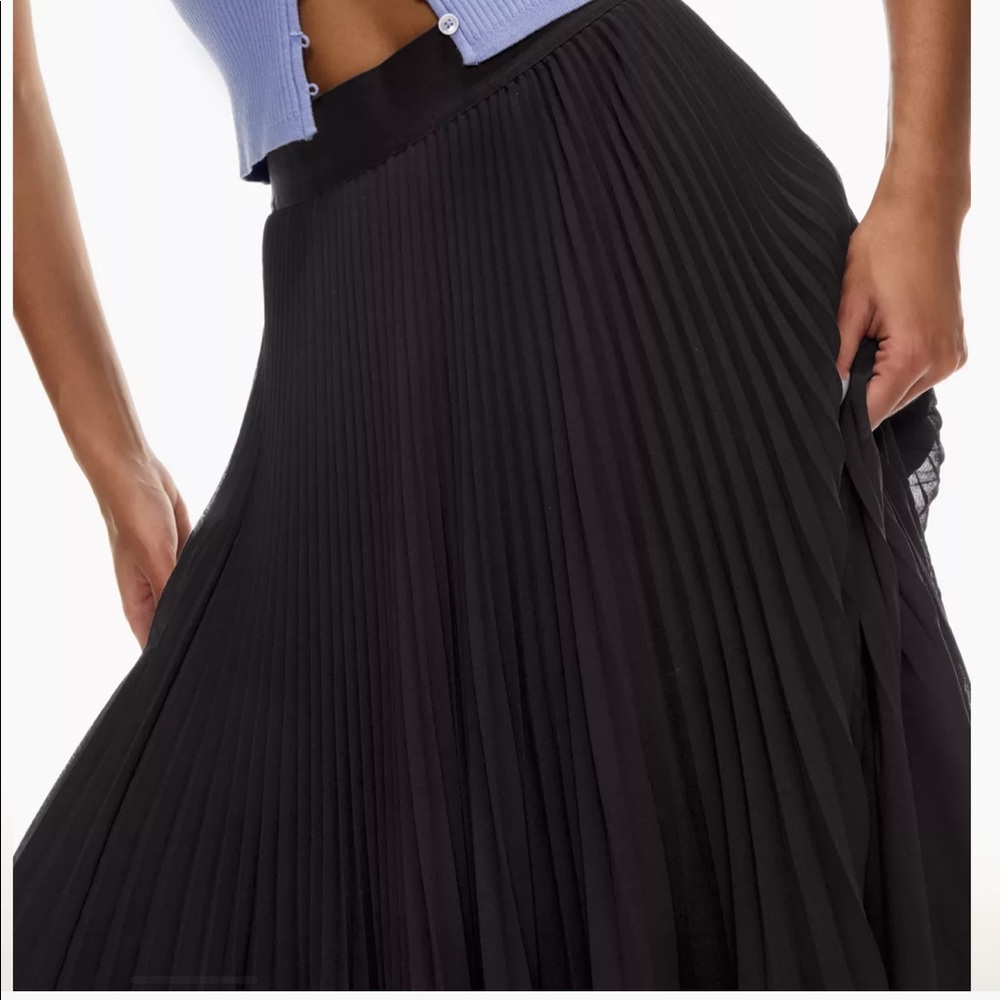 Brand new black high-rise midi skirt with an elastic waist and sunburst pleats.